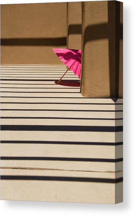 Umbrella Shadows Pink Adobe Santa Fe Canvas Print featuring the photograph Pink umbrella by Carolyn D'Alessandro