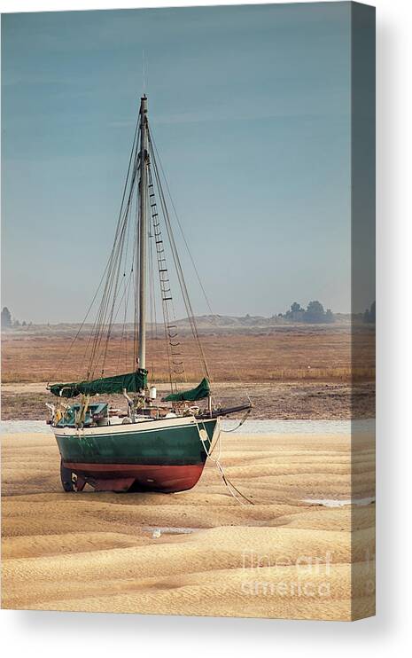 Wells Canvas Print featuring the photograph Norfolk sail boat stranded at low tide by Simon Bratt