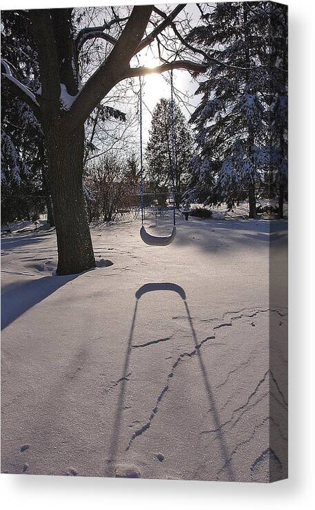 Swings Canvas Print featuring the photograph Swing shadow on Snow by Steve Somerville