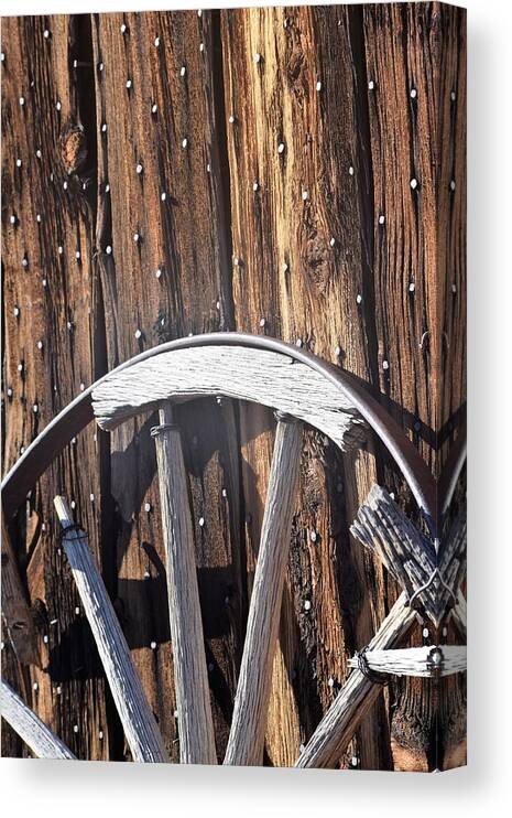 Western Trek Canvas Print featuring the photograph The True Broken Spokes by John Glass