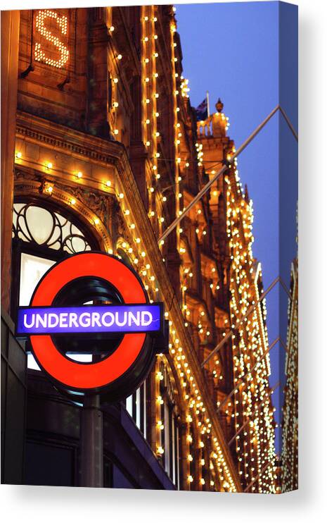 Harrods Canvas Print featuring the photograph The Underground and Harrods at Night by Hermes Fine Art