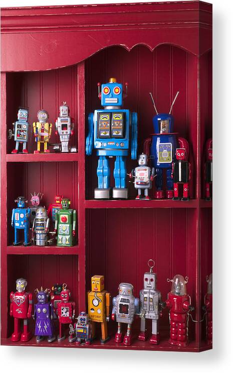 Toy Canvas Print featuring the photograph Toy robots on shelf by Garry Gay