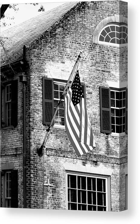 Colonial Canvas Print featuring the photograph US Flag in Colonial Williamsbug by Emanuel Tanjala