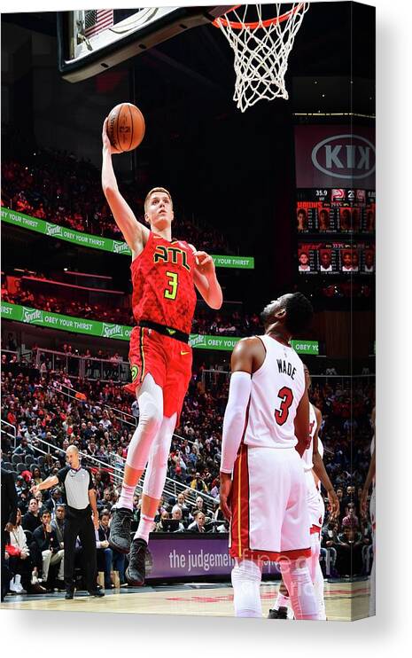 Kevin Huerter Canvas Print featuring the photograph Miami Heat V Atlanta Hawks by Scott Cunningham