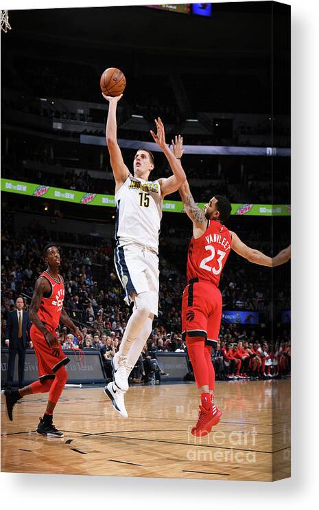 Nba Pro Basketball Canvas Print featuring the photograph Toronto Raptors V Denver Nuggets by Garrett Ellwood