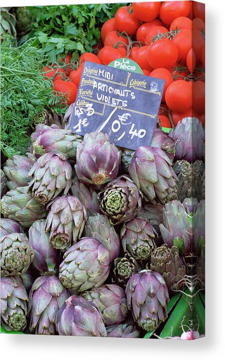 Artichokes For Sale On Market In The Rue Ste. Claire Canvas Print featuring the photograph 390-2198 by Robert Harding Picture Library