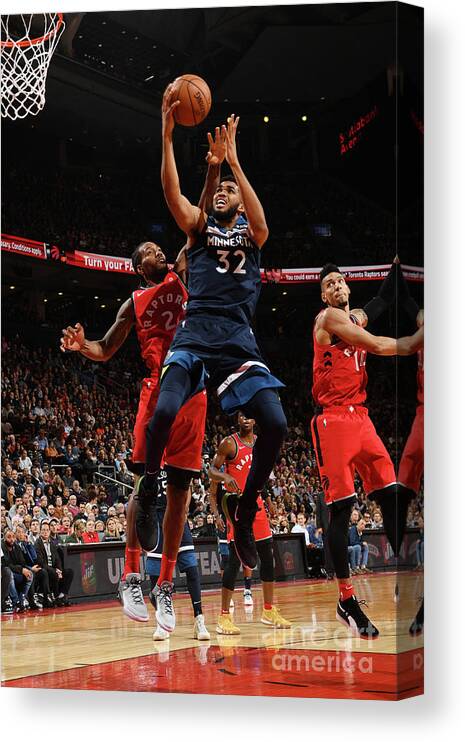 Nba Pro Basketball Canvas Print featuring the photograph Minnesota Timberwolves V Toronto Raptors by Ron Turenne