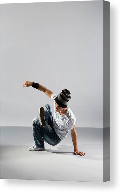 Cool Attitude Canvas Print featuring the photograph A B-boy Doing A Breakdance Move by Halfdark