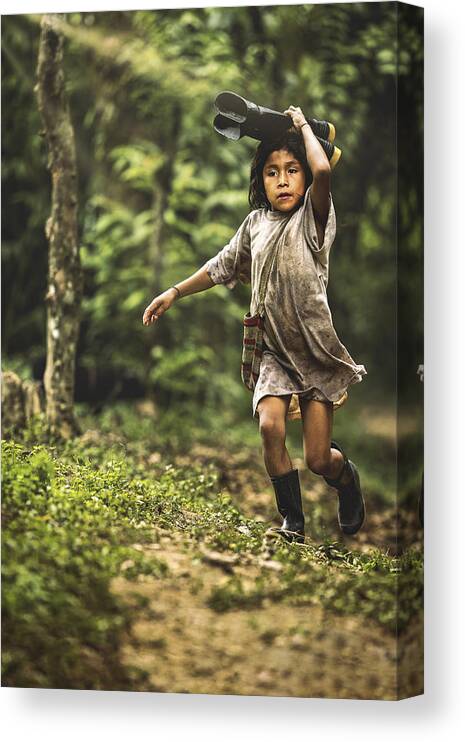 Kid Canvas Print featuring the photograph A Kid Is Running While Holding Boots by Milton Louiz