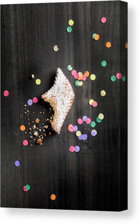 Ip_12965752 Canvas Print featuring the photograph A Muzen german Karneval Pastry, With A Bite Taken Out, And Confetti by Jennifer Braun