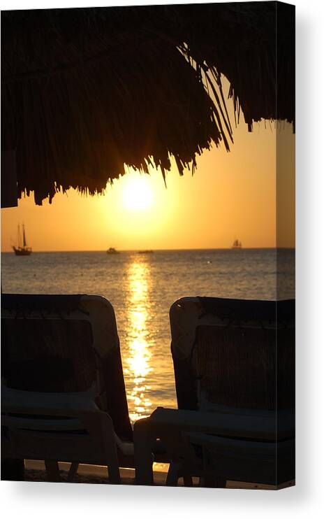 Two Chairs Canvas Print featuring the photograph A Romantic Aruba Sunset by Dennis Schmidt