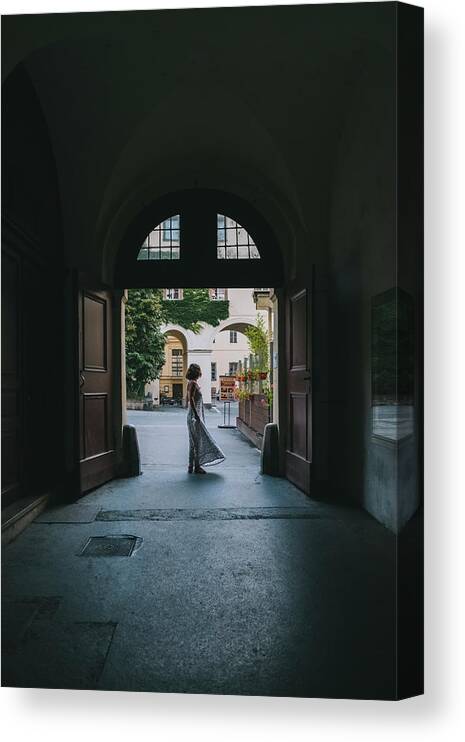 Dress Canvas Print featuring the photograph A Young Woman In A Dress Walking Through Prague Streets, Czechia. by Cavan Images