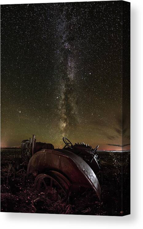 Milky Way Stars Astronomy Astroscape Nightscape Galaxy Tractor Abandoned Vintage Case John Deere Antique Rust Corn Field Stubble Scenic Landscape Horizontal Metal Steampunk North Dakota Nd Rural Ag Agriculture Farming  Canvas Print featuring the photograph Abandoned Tractor headed towards Milky Way by Peter Herman