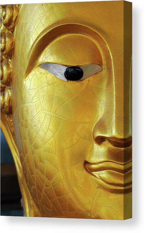 Statue Canvas Print featuring the photograph Buddha Face Close-up At Eye by Dangdumrong