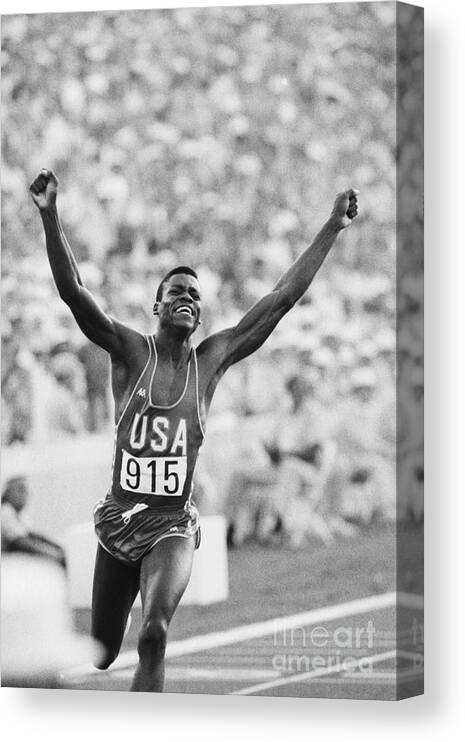 1980-1989 Canvas Print featuring the photograph Carl Lewis Winning Gold Medal by Bettmann