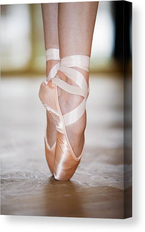 Ballet Dancer Canvas Print featuring the photograph Close-up Of Ballet Dancer On Tiptoes by Beyond Foto