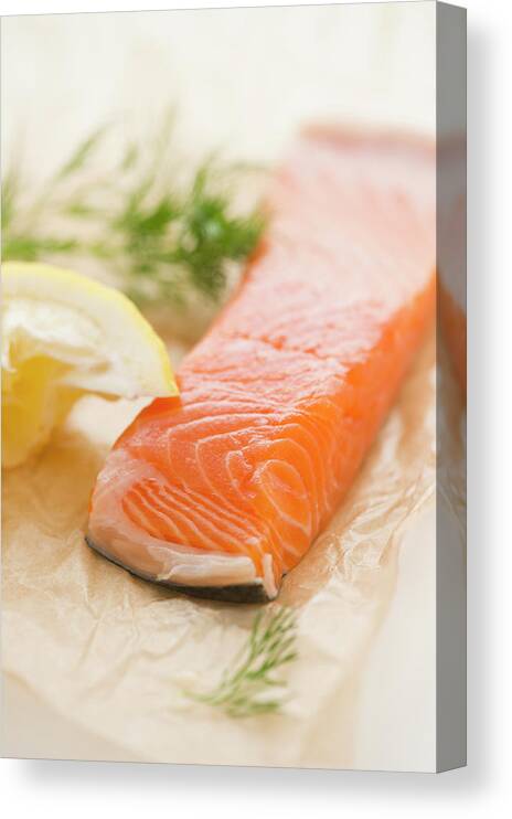 Close-up Canvas Print featuring the photograph Close Up Of Salmon Meat With Lemon And by Jamie Grill