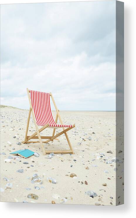 Empty Canvas Print featuring the photograph Deck Chair With Book On Sand At Beach by Dougal Waters