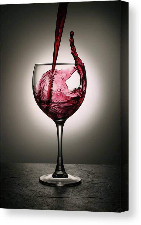#faatoppicks Canvas Print featuring the photograph Dramatic Red Wine Splash Into Wine Glass by Donald gruener