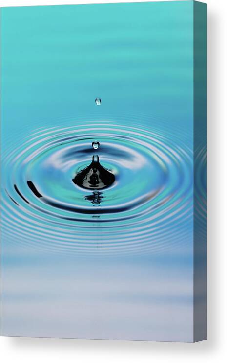 Part Of A Series Canvas Print featuring the photograph Drop Of Water Splashing And Rippling by Digital Vision.