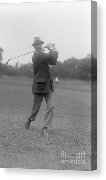 People Canvas Print featuring the photograph Edward Ray Poses Swinging Golf Club by Bettmann