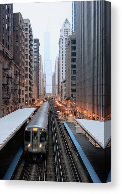 Downtown District Canvas Print featuring the photograph Elevated Commuter Train In Chicago Loop by Photo By John Crouch