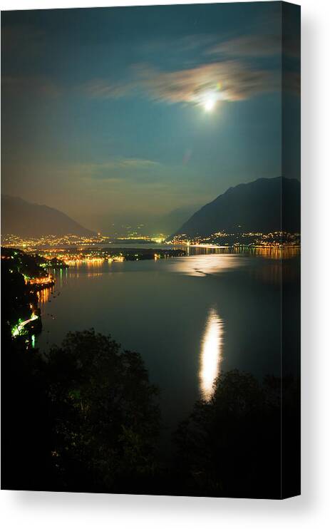 Scenics Canvas Print featuring the photograph Full Moon Over Lake Maggiore In by Assalve