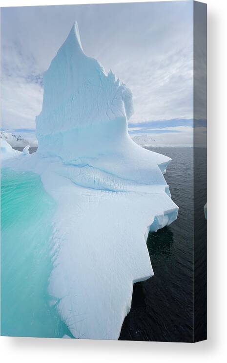 Scenics Canvas Print featuring the photograph Iceberg And Clouds, Antarctic Peninsula by Eastcott Momatiuk