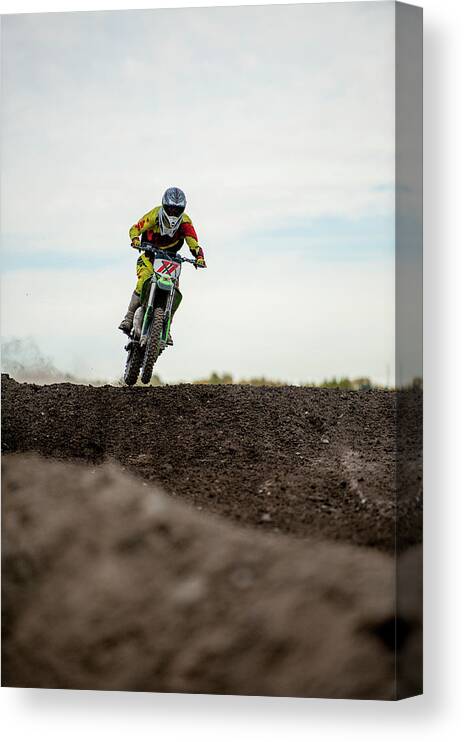 Crash Helmet Canvas Print featuring the photograph Low Angle View Of Motocross Racer On by Ascent Xmedia