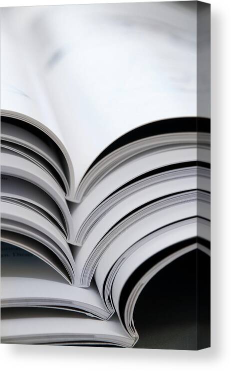 Information Medium Canvas Print featuring the photograph Magazines Side View by Assalve