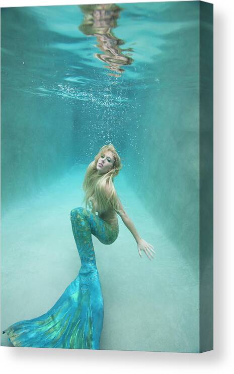 Underwater Canvas Print featuring the photograph Mermaid Swimming Under Water by Ariel Skelley