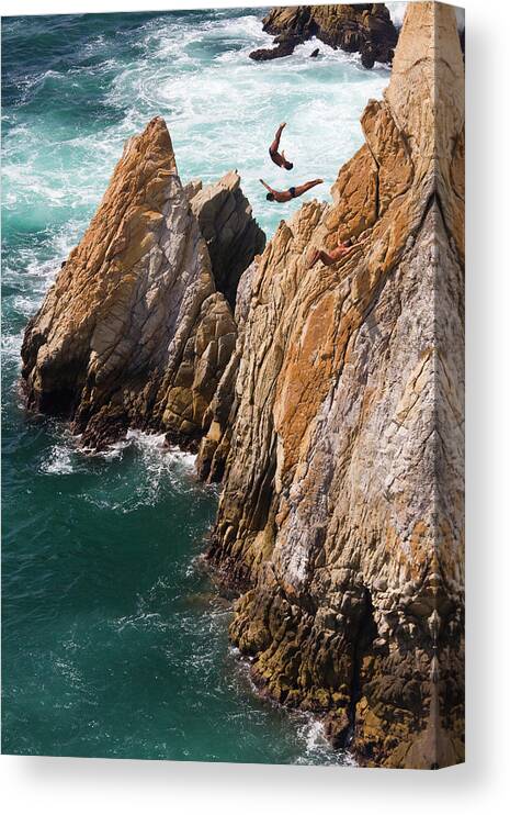 Young Men Canvas Print featuring the photograph Mexico, Acapulco, Cliff Divers by Peter Adams
