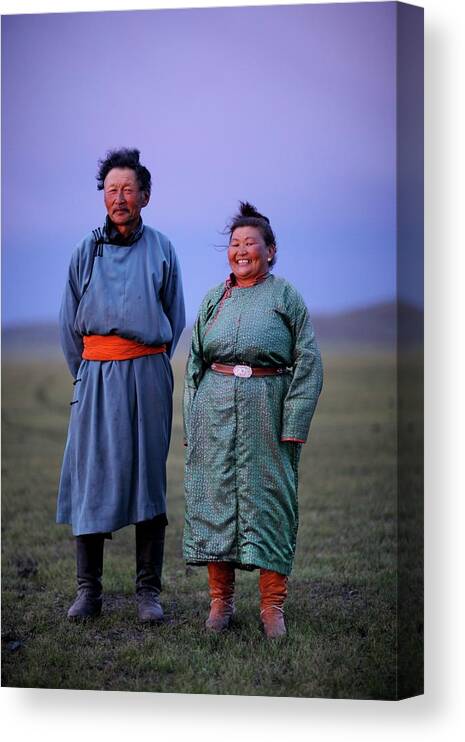 Mongolian Culture Canvas Print featuring the photograph Mongolian Nomadic Couple At Dusk by Timothy Allen