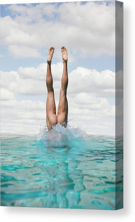 Diving Into Water Canvas Print featuring the photograph Nude Man Diving by Ed Freeman