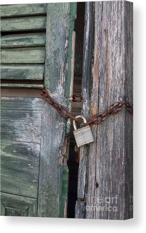 Building Canvas Print featuring the photograph Padlock And Chain On A Door by Jim West/science Photo Library