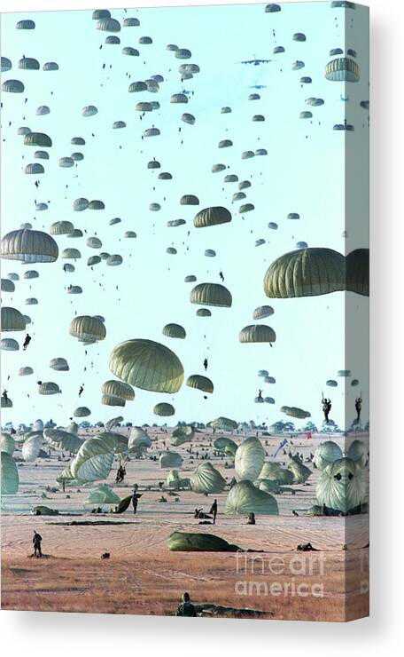 Parachuting Canvas Print featuring the photograph Paratroopers Line The Sky by Bettmann