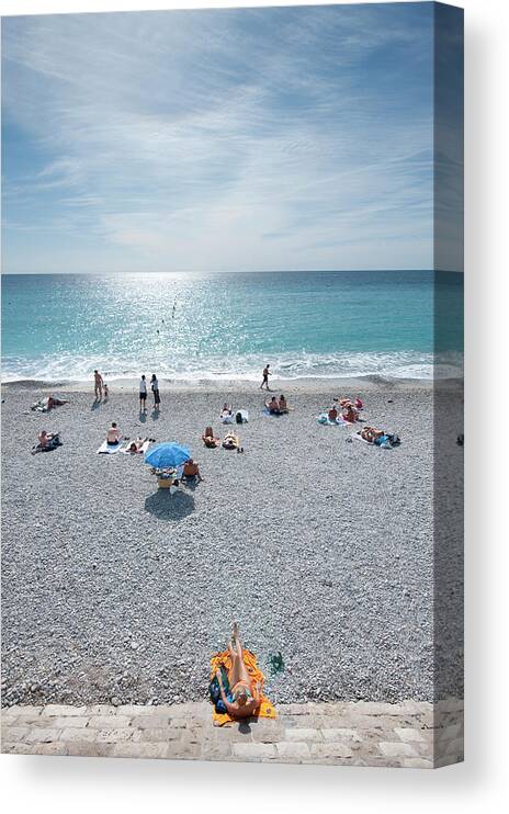 Water's Edge Canvas Print featuring the photograph People Relaxing On Beach Near Opera by Thomas Winz