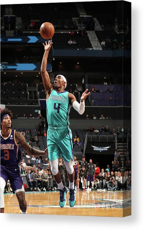 Nba Pro Basketball Canvas Print featuring the photograph Phoenix Suns V Charlotte Hornets by Kent Smith