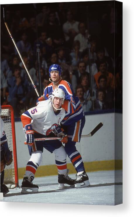 1980-1989 Canvas Print featuring the photograph Potvin And Messier At Nassau Coliseum by B Bennett