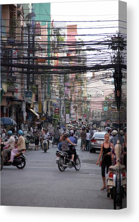Ho Chi Minh City Canvas Print featuring the photograph Power Lines, Cyclos, Tourists And People by Andrew Holt