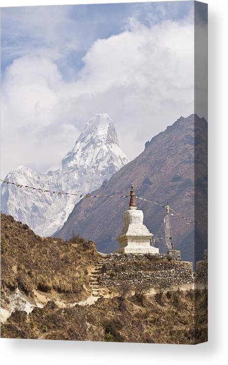 Scenics Canvas Print featuring the photograph Prayer Flags And Ornament On Hillside by Cultura Exclusive/ben Pipe Photography