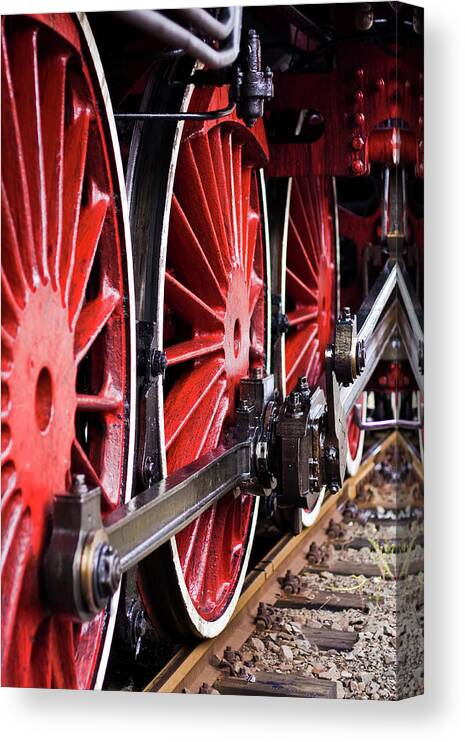 Passenger Train Canvas Print featuring the photograph Red Wheels Of An Old Steam Locomotive by Ewg3d