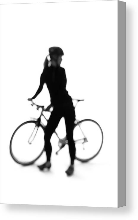 Recreational Pursuit Canvas Print featuring the photograph Silhouette Of A Woman With A Bicycle by Peter Rutherhagen