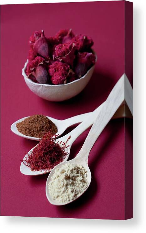 Ip_11160299 Canvas Print featuring the photograph Spoons Of Liquorice Root Powder, Saffron Threads And Cinnamon, With A Bowl Of Pomegranate Flowers by Mche, Hilde