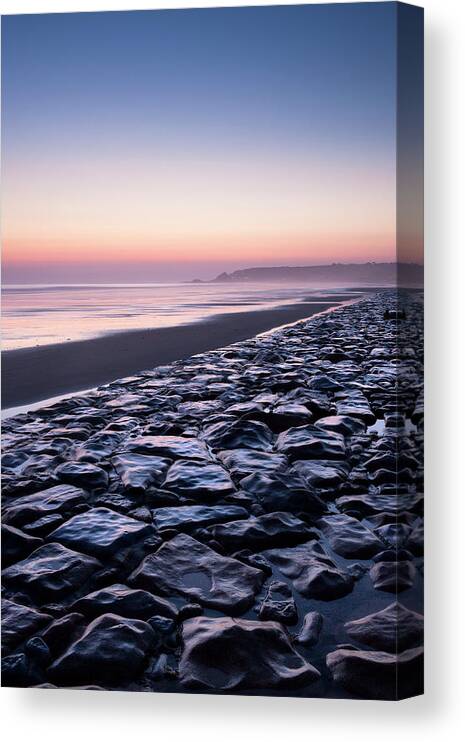 Tranquility Canvas Print featuring the photograph Stone Sea Defence At St Ouens Beach On by David Clapp