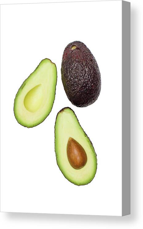 White Background Canvas Print featuring the photograph Studio Shot Of Avocado by Johner Images