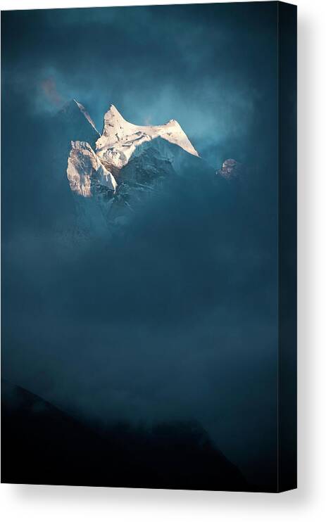 Himalayas Canvas Print featuring the photograph Sunlit Snow Himalaya Peak Dark Swirling by Fotovoyager