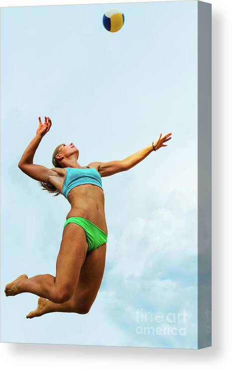 Human Arm Canvas Print featuring the photograph Volleyball Player Serving In Mid-air by Technotr