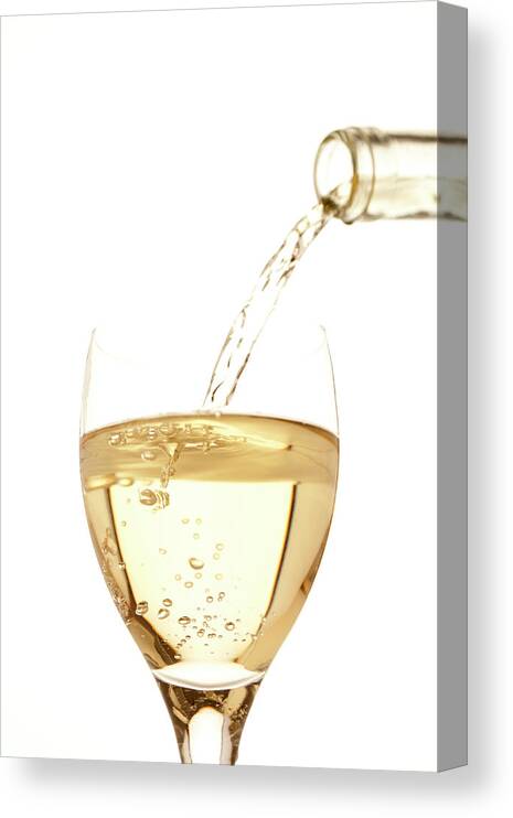 White Background Canvas Print featuring the photograph White Wine Pouring Into A Glass by Ross Durant Photography