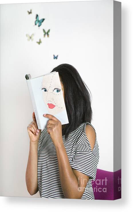 Atmosphere Canvas Print featuring the photograph Woman Covering Face With Book, Reading by Westend61
